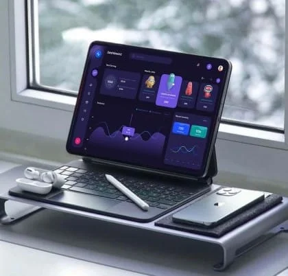 Analytics dashboard on tablet by a window